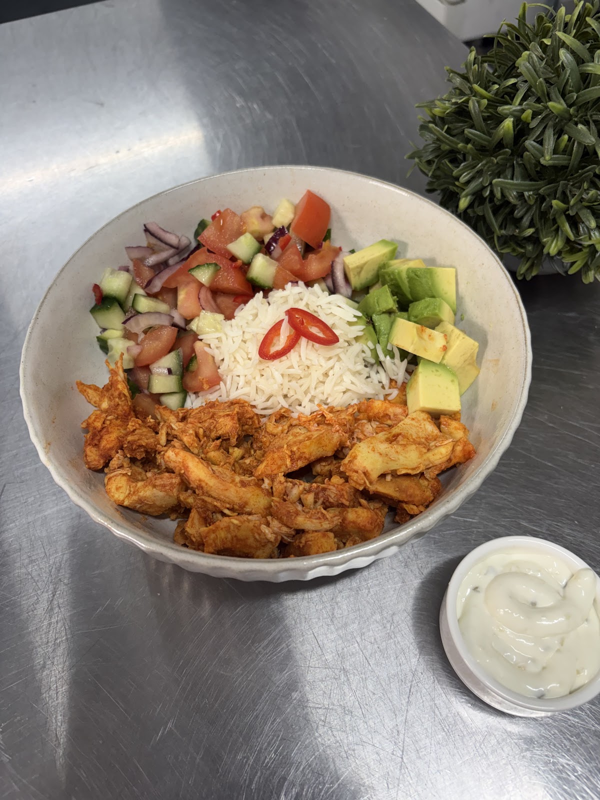 Chicken rice bowl with tomato salsa, avocado and chilli